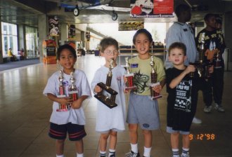 Lisk, Jules, Tezro (Lisk's brother), TheSlimeKing (Jules' brother) after winning a chess tournament.